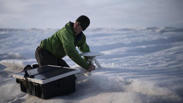 Brian Rougeux, NYU Field Safety Officer, installs a GPS antenna at the Helheim glacier. A NASA satellite found that Greenland’s ice sheet lost about 255 billion metric tons of ice a year between 2003 and 2016, with the loss rate generally getting worse over that period. Nearly all of the 28 Greenland glaciers that Danish climate scientist Ruth Mottram measured are retreating, especially Helheim. (Felipe Dana / AP) Brian Rougeux, NYU Field Safety Officer, installs a GPS antenna at the Helheim glacier. A NASA satellite found that Greenland’s ice sheet lost about 255 billion metric tons of ice a year between 2003 and 2016, with the loss rate generally getting worse over that period. Nearly all of the 28 Greenland glaciers that Danish climate scientist Ruth Mottram measured are retreating, especially Helheim. (Felipe Dana / AP)