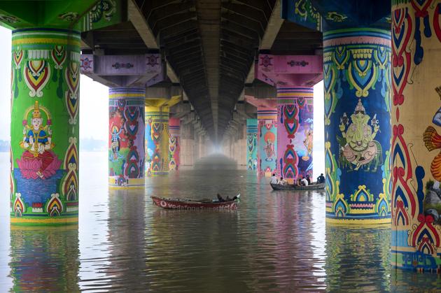A boatman rests on his boat in the flooded Ganges river under the Shastri bridge at Daraganj Ghat, in Allahabad, Uttar Pradesh. (Sanjay Kanojia / AFP) A boatman rests on his boat in the flooded Ganges river under the Shastri bridge at Daraganj Ghat, in Allahabad, Uttar Pradesh. (Sanjay Kanojia / AFP)