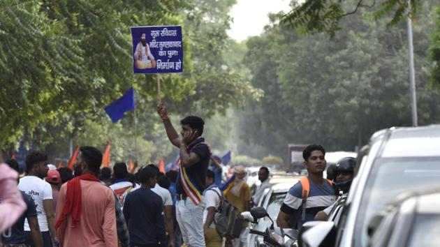 A man holds a placard during a protest against the demolition of Sant Ravidas Temple, in New Delhi. (Sanjeev Verma/HT PHOTO) A man holds a placard during a protest against the demolition of Sant Ravidas Temple, in New Delhi. (Sanjeev Verma/HT PHOTO)