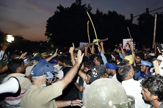 A clash between protesters and police personnel after the protest against the demolition of Sant Ravidas Temple few days back, outside the premises of the temple, at Tughlakabad Extension, in New Delhi. (Sanjeev Verma / HT Photo) A clash between protesters and police personnel after the protest against the demolition of Sant Ravidas Temple few days back, outside the premises of the temple, at Tughlakabad Extension, in New Delhi. (Sanjeev Verma / HT Photo)