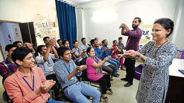 Noida Deaf Society founder Ruma Roka (right) at a remedial class for the hearing impaired.(Virendra Singh Gosain/HT PHOTO)
