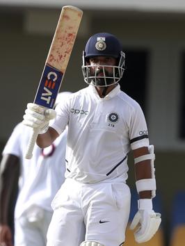 India's Ajinkya Rahane celebrates scoring half a century against West Indies. (AP) India's Ajinkya Rahane celebrates scoring half a century against West Indies. (AP)