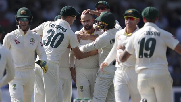 Australian players congratulate Nathan Lyon, centre, after dismissing England's captain Joe Root.(AP) Australian players congratulate Nathan Lyon, centre, after dismissing England's captain Joe Root.(AP)