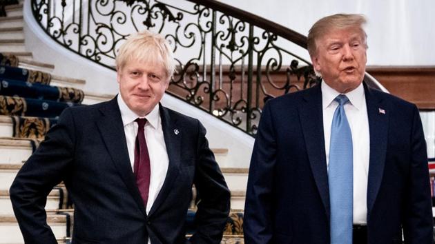 US President Donald Trump and Britain's Prime Minister Boris Johnson arrive for a bilateral meeting during the G7 summit in Biarritz, France.(Reuters photo)