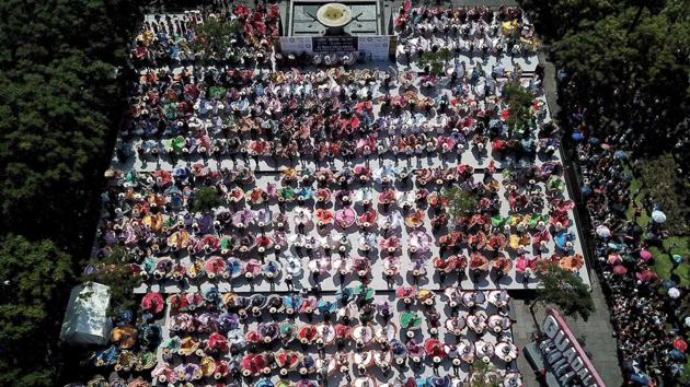 An aerial view of couples dancing to traditional Mariachi music. The previous record, also set in Guadalajara in 2011 has comprised 457 participants. (Ulises Ruiz / AFP) An aerial view of couples dancing to traditional Mariachi music. The previous record, also set in Guadalajara in 2011 has comprised 457 participants. (Ulises Ruiz / AFP)