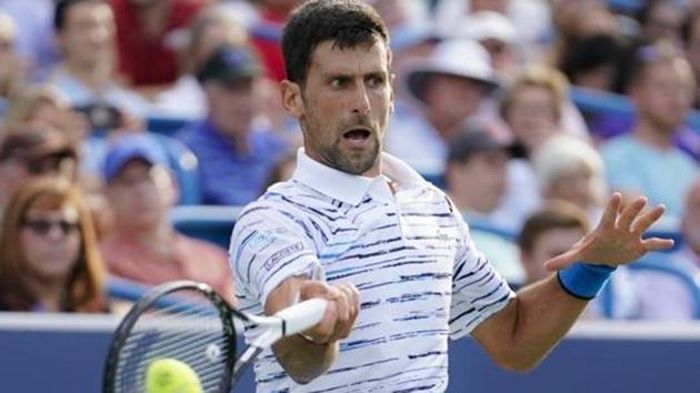 Novak Djokovic, of Serbia, hits a forehand to Daniil Medvedev, of Russia, during the Western & Southern Open tennis tournament Saturday, Aug. 17, 2019, in Mason, Ohio. (AP) Novak Djokovic, of Serbia, hits a forehand to Daniil Medvedev, of Russia, during the Western & Southern Open tennis tournament Saturday, Aug. 17, 2019, in Mason, Ohio. (AP)