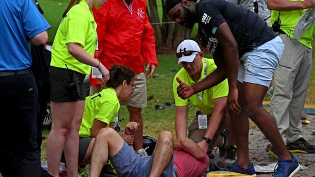 Fans are assisted by medical personnel after a lightning strike.(USA TODAY Sports)