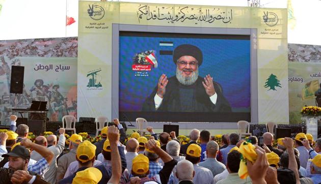 Lebanon's Hezbollah leader Sayyed Hassan Nasrallah gestures as he addresses his supporters via a screen during a rally marking the anniversary of the defeat of militants near the Lebanese-Syrian border, in al-Ain village, Lebanon August 25, 2019. (REUTERS) Lebanon's Hezbollah leader Sayyed Hassan Nasrallah gestures as he addresses his supporters via a screen during a rally marking the anniversary of the defeat of militants near the Lebanese-Syrian border, in al-Ain village, Lebanon August 25, 2019. (REUTERS)
