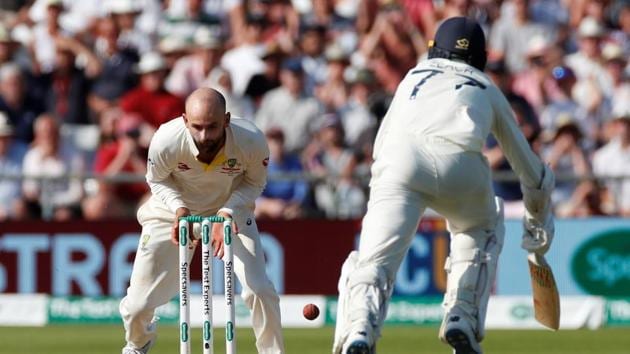 Nathan Lyon as he drops the ball at the wicket and England's Jack Leech runs back in.(Action Images via Reuters)