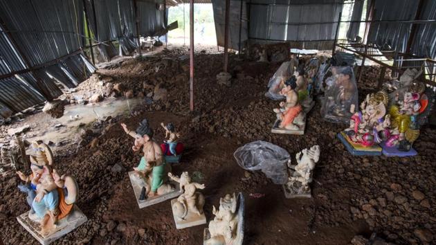 Idols in various stages of completion sit to dry under a shed. Many artisans in the town reported losses of raw materials in the range of 50-70% due to the rains. Maharashtra received 104% of the average rainfall between June and August this year though Marathwada and parts of Vidarbha remained rain-deficient, CM Devendra Fadnavis said during a review of the situation earlier this month. (Satish Bate / HT Photo) Idols in various stages of completion sit to dry under a shed. Many artisans in the town reported losses of raw materials in the range of 50-70% due to the rains. Maharashtra received 104% of the average rainfall between June and August this year though Marathwada and parts of Vidarbha remained rain-deficient, CM Devendra Fadnavis said during a review of the situation earlier this month. (Satish Bate / HT Photo)