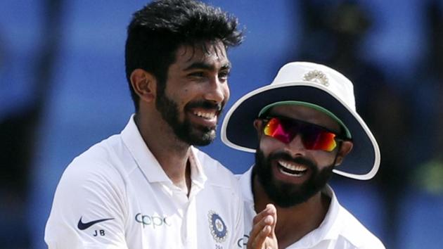 India's Jasprit Bumrah celebrates with KL Rahul after taking the wicket of West Indies' Shai Hope.(AP)