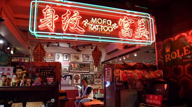 The magnitude of the ongoing protests is what has brought people together, said Vincent Yau, another Hong Kong tattoo artist. “A lot of people want to commemorate this,” Yau said, and tattoos are a way to “say to yourself that you were part of a movement this big.” Yau said his studio had been doing most of the tattoos for free. “It’s our way of supporting this movement,” he said. (Lillian Suwanrumpha / AFP) The magnitude of the ongoing protests is what has brought people together, said Vincent Yau, another Hong Kong tattoo artist. “A lot of people want to commemorate this,” Yau said, and tattoos are a way to “say to yourself that you were part of a movement this big.” Yau said his studio had been doing most of the tattoos for free. “It’s our way of supporting this movement,” he said. (Lillian Suwanrumpha / AFP)
