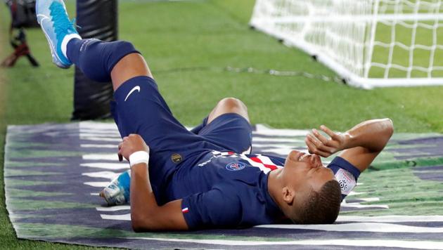 Paris St Germain's Kylian Mbappe reacts after sustaining an injury(REUTERS)