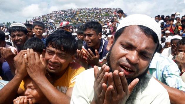 Rohingya refugees take part in a prayer as they gather to mark the second anniversary of the exodus at the Kutupalong camp in Cox’s Bazar, Bangladesh.(Reuters photo)