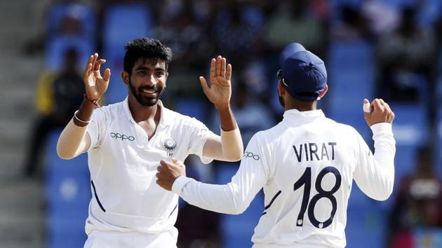 India's Jasprit Bumrah celebrates with team captain Virat Kohli(AP)