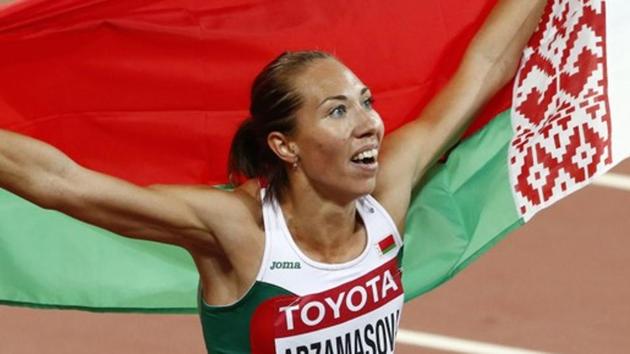 FILE PHOTO: Marina Arzamasova of Belarus holds her national flag.(REUTERS)