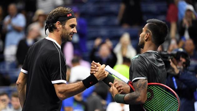 Roger Federer of Switzerland, left, and Sumit Nagal of India shake hands after their match(USA TODAY Sports)