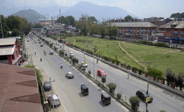 Vehicles move on the road after the ease of restriction in Srinagar on Monday.(ANI Photo) Vehicles move on the road after the ease of restriction in Srinagar on Monday.(ANI Photo)