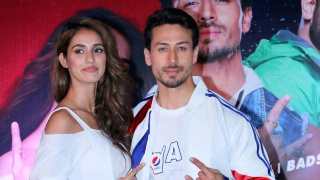 Disha Patani and Tiger Shroff pose together for the camera.