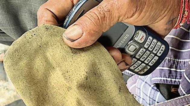 The pouch looks like an old-fashioned wallet but its owner uses it to keep his mobile. (HT Photo) The pouch looks like an old-fashioned wallet but its owner uses it to keep his mobile. (HT Photo)
