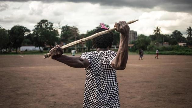 A Ngbaba player stretches out before a game in Bangui. Ngbaba is a traditional Central African sport which fell into disuse in the 2000s due to the security situation in the country, and is now being revived by young enthusiasts thanks to the lull in the conflict. The sport, is unique to the Central African Republic -- and, almost like the embattled country itself, has been hauled back from near-death. (Florent Vergnes / AFP)