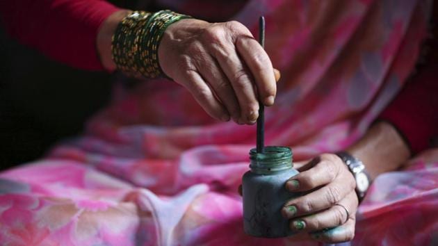 Tej Kumari mixes colour to make paintings at her residence. While painting snake gods for the Hindu festival of Naag Pancahami, Tej Kumari recalled days when she would make thousands of posters for people to paste on their doors in August. This year she made only about 50. (Niranjan Shrestha / AP) Tej Kumari mixes colour to make paintings at her residence. While painting snake gods for the Hindu festival of Naag Pancahami, Tej Kumari recalled days when she would make thousands of posters for people to paste on their doors in August. This year she made only about 50. (Niranjan Shrestha / AP)