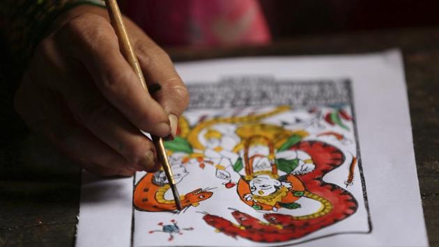Tej Kumari Chitrakar makes a painting ahead of Naag Panchami festival. Nepalese history and culture expert Satya Mohan Joshi said there were positive and negative aspects of this system back then.“The bad thing was it created a basis for discrimination. The good thing was it created expertise in each sector,” he said, allowing the Chitrakar’s distinct painting style to continue and flourish. (Niranjan Shrestha / AP) Tej Kumari Chitrakar makes a painting ahead of Naag Panchami festival. Nepalese history and culture expert Satya Mohan Joshi said there were positive and negative aspects of this system back then.“The bad thing was it created a basis for discrimination. The good thing was it created expertise in each sector,” he said, allowing the Chitrakar’s distinct painting style to continue and flourish. (Niranjan Shrestha / AP)