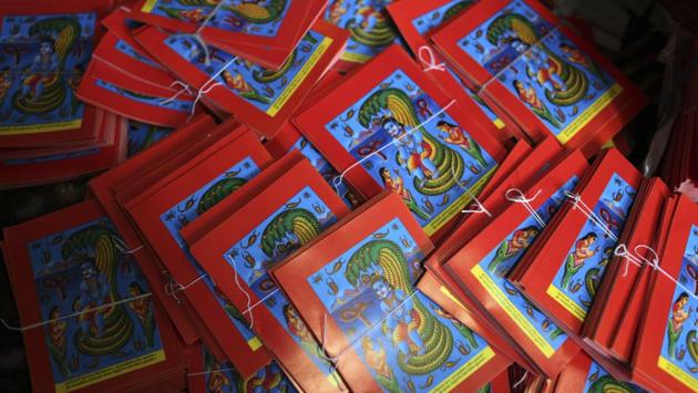 Machine printed posters are seen ahead of Naag Panchami at a store in Kathmandu. The art and tradition, however, is dying because of mass machine printed posters and card-size pictures of gods that are cheaper and have become more popular. (Niranjan Shrestha / AP) Machine printed posters are seen ahead of Naag Panchami at a store in Kathmandu. The art and tradition, however, is dying because of mass machine printed posters and card-size pictures of gods that are cheaper and have become more popular. (Niranjan Shrestha / AP)