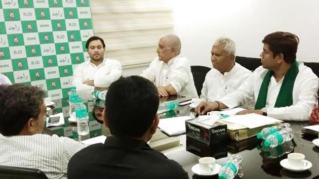 RJD leader Tejashwi Yadav with other leaders of Grand Alliance at a meeting on Monday, August 26, 2019.(Santosh Kumar / HT Photo)