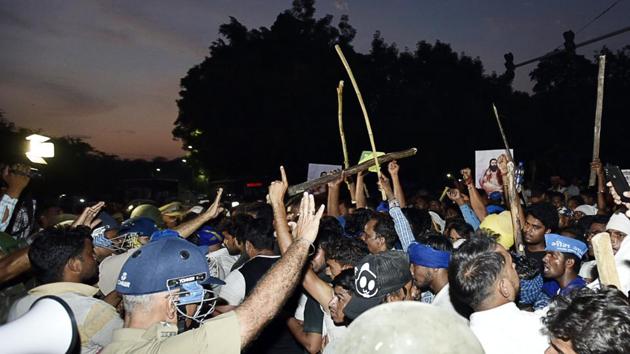 A clash between protesters and police personnel after the protest against the demolition of Sant Ravidas Temple few days back, outside the premises of the temple, at Tughlakabad Extension, in New Delhi. (Sanjeev Verma /HT PHOTO) A clash between protesters and police personnel after the protest against the demolition of Sant Ravidas Temple few days back, outside the premises of the temple, at Tughlakabad Extension, in New Delhi. (Sanjeev Verma /HT PHOTO)