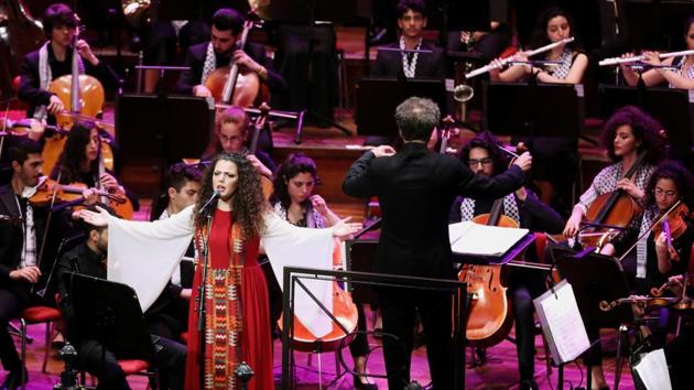 Singer Nai Barghouti of the Palestine Youth Orchestra sings during their final performance in Amsterdam. She and her compatriots earned standing ovations at the finale in Amsterdam’s palatial Concertgebouw. (Eva Plevier / REUTERS) 