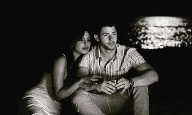 Priyanka Chopra and Nick Jonas sit quietly together in a new photo.