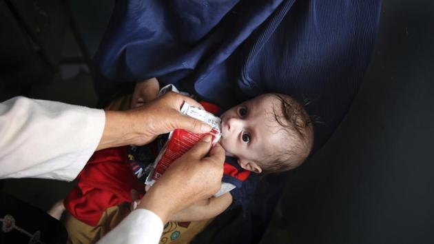 The urgency of aid is seen in Jebul Siraj, a mountainside community north of Kabul, where a burqa-clad woman held a gaunt, startled-looking boy named Abdullah, just 7 months old. Days ago, he was at an emergency ward. Now he sipped curiously at a supplement as part of a new nutrition monitoring program at a clinic supported by the UN children’s agency. Mothers and children lined up outside. (Rafiq Maqbool / AP) The urgency of aid is seen in Jebul Siraj, a mountainside community north of Kabul, where a burqa-clad woman held a gaunt, startled-looking boy named Abdullah, just 7 months old. Days ago, he was at an emergency ward. Now he sipped curiously at a supplement as part of a new nutrition monitoring program at a clinic supported by the UN children’s agency. Mothers and children lined up outside. (Rafiq Maqbool / AP)