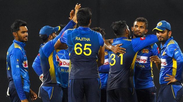 Representative image: File image of Sri Lankan players celebrating after the fall of a wicket during a match.(AFP)