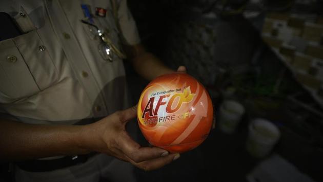 In several buildings, residents have ordered fire extinguisher balls through the internet. These can be put up near fire hazards —they burst if the heat rises, and release a chemical that douses the flames. A decision on equipping every building with a cost-effective safety harness is also being contemplated since the elderly, those not able-bodied or women and children may find it difficult to climb down in an emergency. (Biplov Bhuyan / HT Photo) In several buildings, residents have ordered fire extinguisher balls through the internet. These can be put up near fire hazards —they burst if the heat rises, and release a chemical that douses the flames. A decision on equipping every building with a cost-effective safety harness is also being contemplated since the elderly, those not able-bodied or women and children may find it difficult to climb down in an emergency. (Biplov Bhuyan / HT Photo)