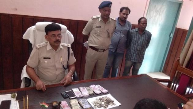 Police also recovered Rs 1.2 lakh and two mobile phone from the house at Kharauli village. (HT photo) Police also recovered Rs 1.2 lakh and two mobile phone from the house at Kharauli village. (HT photo)