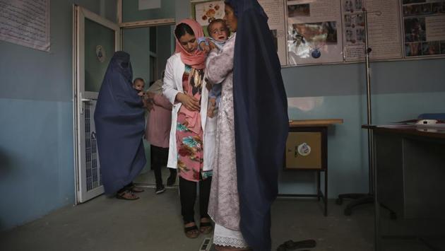 A doctor checks the weight of a mother and her son at a UNICEF clinic. Asked how the interest of President Donald Trump’s administration in cutting overall foreign aid complicates the situation, Lanzer paused for more than 10 seconds before saying that “when it comes to a strategic location such as Afghanistan, everybody has to chip in, and everybody has been chipping in.” (Rafiq Maqbool / AP) A doctor checks the weight of a mother and her son at a UNICEF clinic. Asked how the interest of President Donald Trump’s administration in cutting overall foreign aid complicates the situation, Lanzer paused for more than 10 seconds before saying that “when it comes to a strategic location such as Afghanistan, everybody has to chip in, and everybody has been chipping in.” (Rafiq Maqbool / AP)