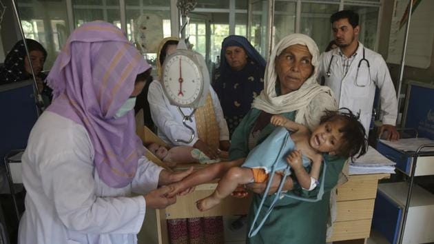 Nearby was Bibi Warai. Her 2-year-old granddaughter had just died at home, and now the girl’s 3-year-old sister, Humaira, was undergoing treatment. After their hours-long journey she wished for more such wards so that all Afghans can reach help in time. “My son told me, ‘How can you leave us at this time of mourning?’” she said. “I told him, ‘I can’t stay, I have to take my child for treatment.’ Maybe God will help us, and she will survive.” (Rafiq Maqbool / AP) Nearby was Bibi Warai. Her 2-year-old granddaughter had just died at home, and now the girl’s 3-year-old sister, Humaira, was undergoing treatment. After their hours-long journey she wished for more such wards so that all Afghans can reach help in time. “My son told me, ‘How can you leave us at this time of mourning?’” she said. “I told him, ‘I can’t stay, I have to take my child for treatment.’ Maybe God will help us, and she will survive.” (Rafiq Maqbool / AP)
