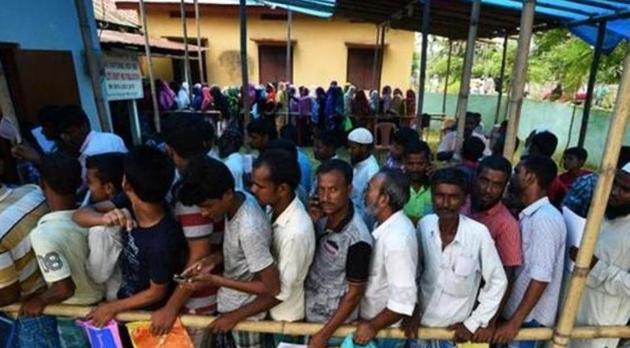 People wait in queue to check their names on the draft list at the National Register of Citizens (NRC) centre at a village in Nagaon district, Assam state, India.(REUTERS)