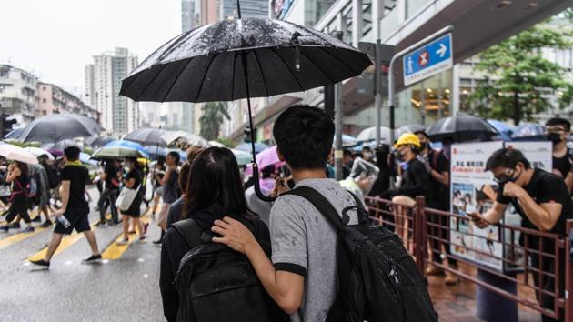 The couple’s motivation is long-standing, both seeking to make right the failure of the “Umbrella Movement” protests of 2014 which withered after two and a half months. This time protests show little sign of abating, with the extradition bill sharpening their focus. The bill, which has been suspended but not formally withdrawn, is an emblem of Beijing’s creeping control over a city which enjoys unique freedoms. (Anthony Wallace / AFP) The couple’s motivation is long-standing, both seeking to make right the failure of the “Umbrella Movement” protests of 2014 which withered after two and a half months. This time protests show little sign of abating, with the extradition bill sharpening their focus. The bill, which has been suspended but not formally withdrawn, is an emblem of Beijing’s creeping control over a city which enjoys unique freedoms. (Anthony Wallace / AFP)