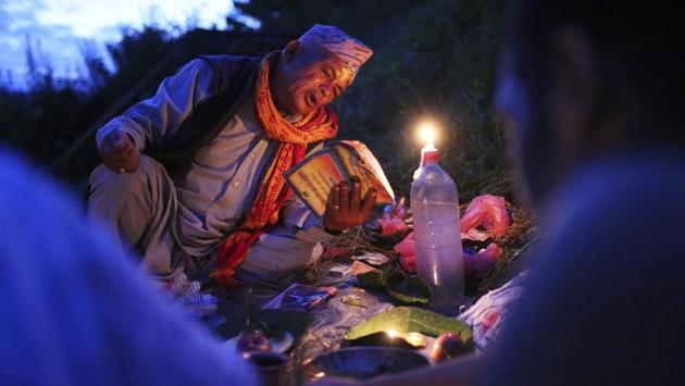 A Nepalese priest performs rituals for a devotee during Kuse Aunsi festival in Kathmandu, Nepal. Kuse Aunsi is a festival of Nepal where fathers, living or dead, are honoured. Children with living fathers show their appreciation by giving presents and sweets and those whose fathers are deceased pay tributes at the Gokarneshwar temple. (Niranjan Shrestha / AP) A Nepalese priest performs rituals for a devotee during Kuse Aunsi festival in Kathmandu, Nepal. Kuse Aunsi is a festival of Nepal where fathers, living or dead, are honoured. Children with living fathers show their appreciation by giving presents and sweets and those whose fathers are deceased pay tributes at the Gokarneshwar temple. (Niranjan Shrestha / AP)