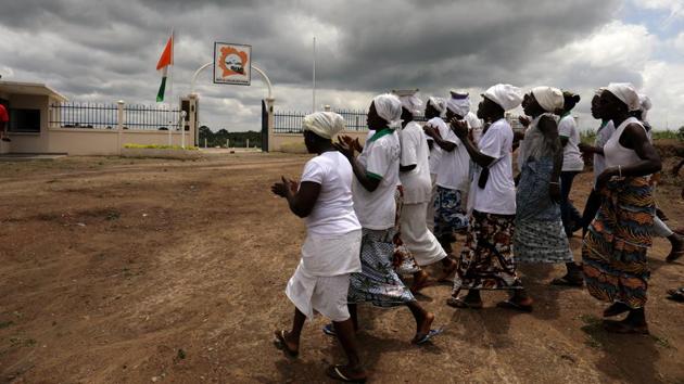 Women in procession dance outside a slavery memorial site near the Bodo river in Kanga Nianze village, in Tiassale, Ivory Coast. Men and women captured in Ivory Coast and sold into slavery 400 years ago would take their final bath in the river before being loaded onto ships. (Luc Gnago / REUTERS) Women in procession dance outside a slavery memorial site near the Bodo river in Kanga Nianze village, in Tiassale, Ivory Coast. Men and women captured in Ivory Coast and sold into slavery 400 years ago would take their final bath in the river before being loaded onto ships. (Luc Gnago / REUTERS)