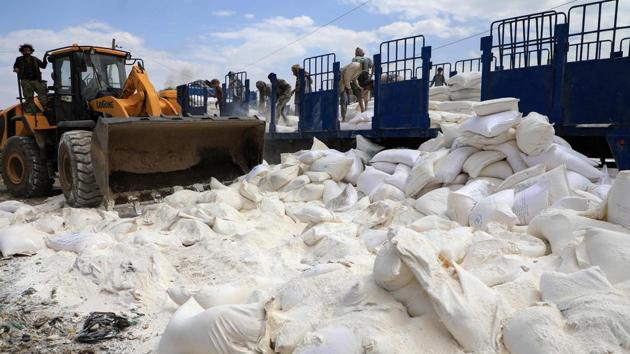 Yemen’s Houthi rebels dispose of expired aid packages from the World Food Programme (WFP) in the capital Sanaa. The rebels destroyed a consignment of what they said was gone-off United Nations food aid for the war-torn country, which is teetering on the edge of famine. (Mohamed Huwais / AFP) Yemen’s Houthi rebels dispose of expired aid packages from the World Food Programme (WFP) in the capital Sanaa. The rebels destroyed a consignment of what they said was gone-off United Nations food aid for the war-torn country, which is teetering on the edge of famine. (Mohamed Huwais / AFP)