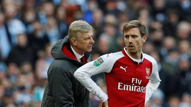 File photo of Arsenal manager Arsene Wenger with Nacho Monreal.(REUTERS)