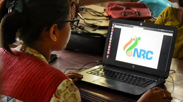 An official checks the documents submitted by people at an National Register of Citizens (NRC) Seva Kendra in Guwahati, Friday, Aug 30, 2019.(PTI)