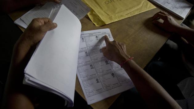 The final NRC list at Buraburi village of Morigaon district. The NRC, first prepared only for Assam in 1951, was updated since 2015 following directions from the Supreme Court. The demand for identification of illegal immigrants, deletion of their names from voter lists and deportation started in 1979, with All Assam Students Union (AASU), spearheading a 6-year agitation. The complete draft of NRC released in July, 2018 had left out 4 million applicants. (Anupam Nath / AP) The final NRC list at Buraburi village of Morigaon district. The NRC, first prepared only for Assam in 1951, was updated since 2015 following directions from the Supreme Court. The demand for identification of illegal immigrants, deletion of their names from voter lists and deportation started in 1979, with All Assam Students Union (AASU), spearheading a 6-year agitation. The complete draft of NRC released in July, 2018 had left out 4 million applicants. (Anupam Nath / AP)