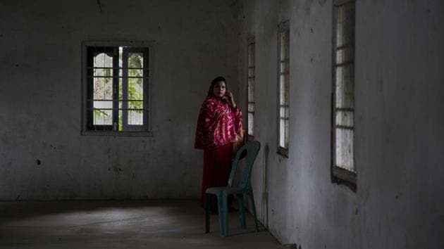 A woman who made it to the final list talks on a mobile phone to her husband, at Buraburi village in Morigaon district. The final NRC is a supplementary list of inclusion or exclusion of those applicants whose names were not included in earlier drafts, those who faced objections on their inclusions or those who were in the earlier drafts but called for hearings that took place since July this year. (Anupam Nath / AP) A woman who made it to the final list talks on a mobile phone to her husband, at Buraburi village in Morigaon district. The final NRC is a supplementary list of inclusion or exclusion of those applicants whose names were not included in earlier drafts, those who faced objections on their inclusions or those who were in the earlier drafts but called for hearings that took place since July this year. (Anupam Nath / AP)