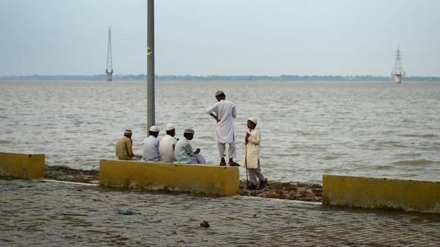 Students of a Madrasa sit on the bank of river Ganges as flood waters receded at the Sangam area in Allahabad, Uttar Pradesh. (Sanjay Kanojia / AFP) 