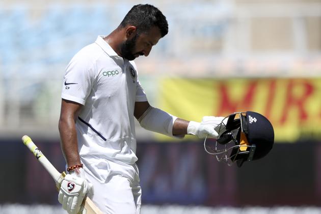 India's Cheteshwar Pujara leaves the field, dismissed for 6 runs, during day one of the second Test. (AP) India's Cheteshwar Pujara leaves the field, dismissed for 6 runs, during day one of the second Test. (AP)