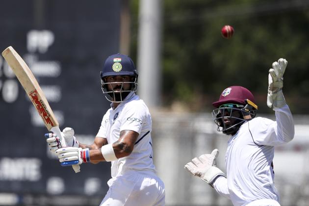 West Indies' wicket keeper Jahmar Hamilton fails to catch a shot played by India's captain Virat Kohli during day one of the second Test. (AP) West Indies' wicket keeper Jahmar Hamilton fails to catch a shot played by India's captain Virat Kohli during day one of the second Test. (AP)
